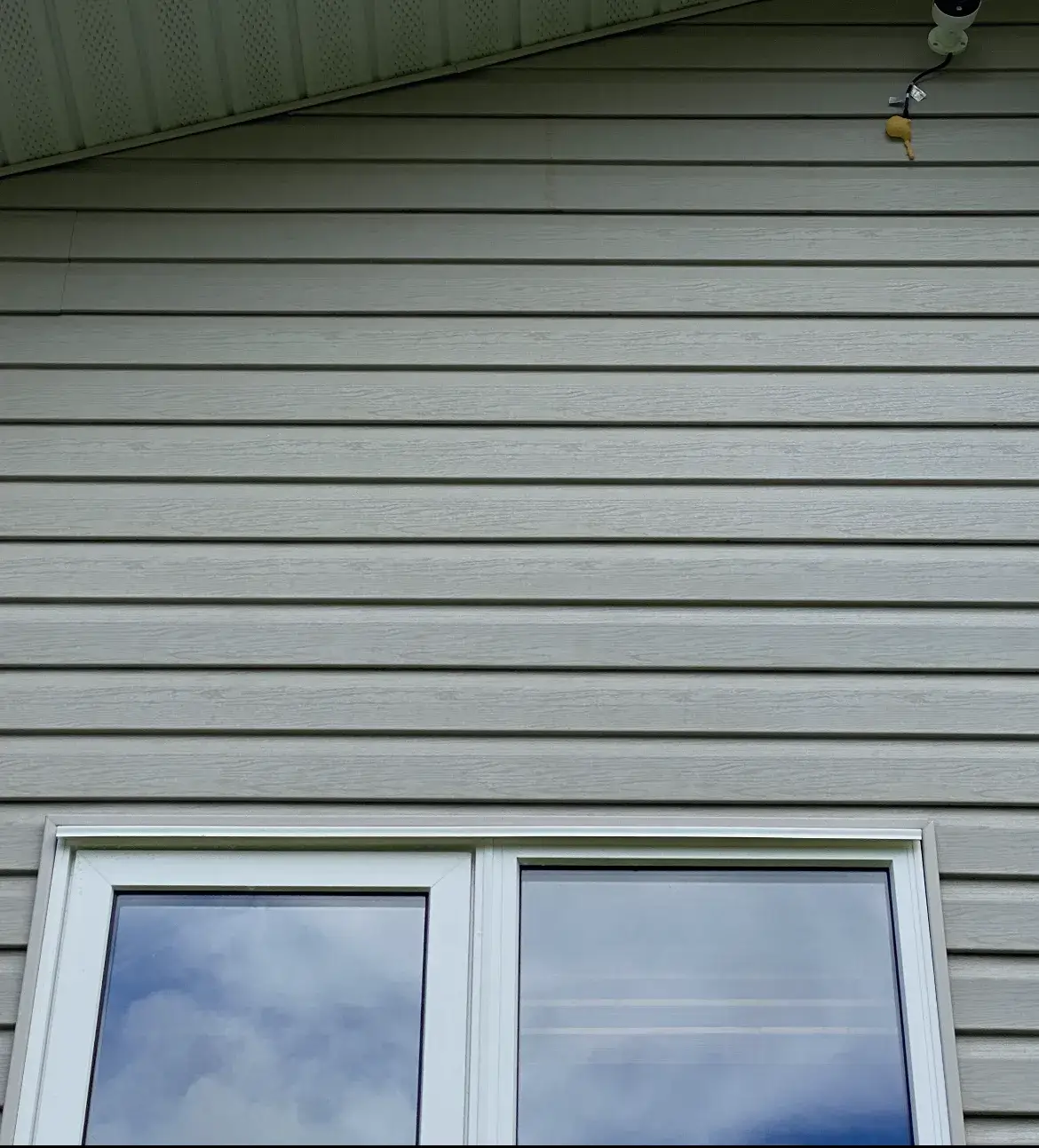 After: the same siding with the streaking removed
